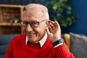 Life Assure Senior Relaxing Reading Book On Couch Hero